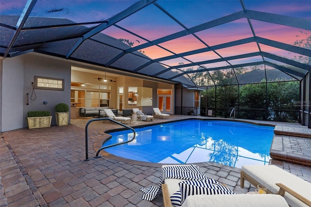 32 Allenwood Look, Ormond Beach, FL 32174 - pool at dusk with an outdoor pool, a patio, outdoor lounge area, and glass enclosure