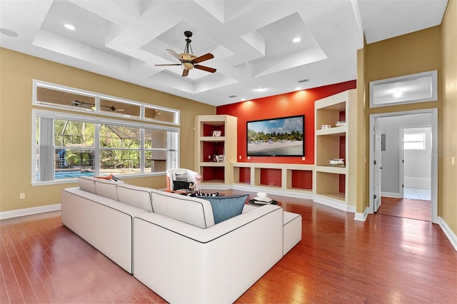 32 Allenwood Look, Ormond Beach, FL 32174 - living area with wood finished floors, coffered ceiling, ceiling fan, built in shelves, and healthy amount of natural light