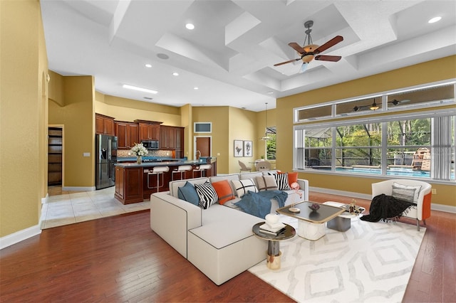32 Allenwood Look, Ormond Beach, FL 32174 - living room with coffered ceiling, light wood-type flooring, ceiling fan, recessed lighting, and beam ceiling