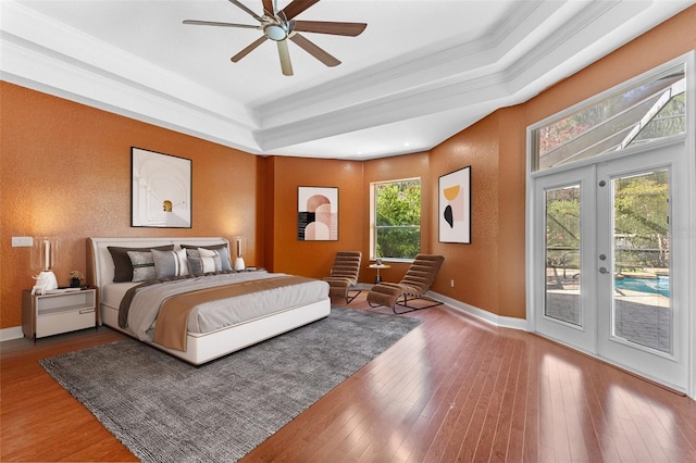 32 Allenwood Look, Ormond Beach, FL 32174 - bedroom featuring access to outside, a raised ceiling, french doors, and hardwood / wood-style floors