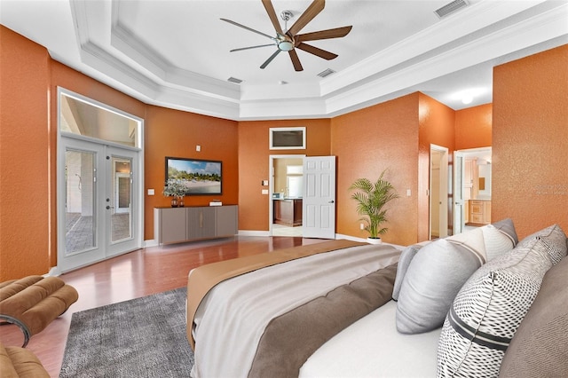 32 Allenwood Look, Ormond Beach, FL 32174 - bedroom with a tray ceiling, ornamental molding, wood finished floors, access to exterior, and a textured wall