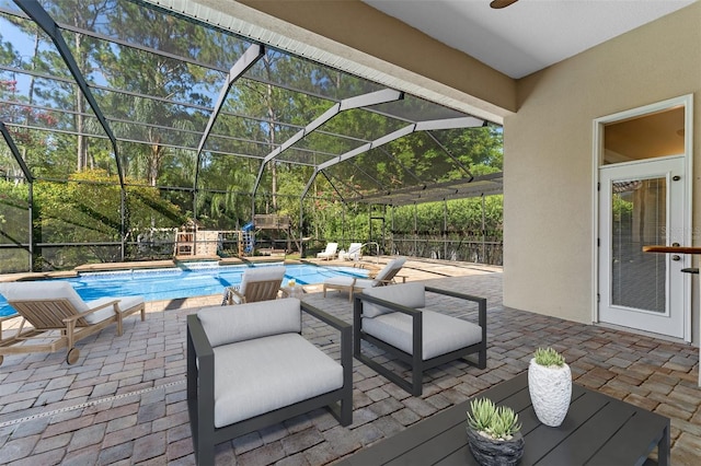 32 Allenwood Look, Ormond Beach, FL 32174 - outdoor pool featuring a patio area, a ceiling fan, and glass enclosure