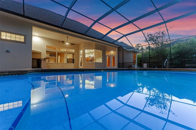 32 Allenwood Look, Ormond Beach, FL 32174 - pool at dusk with an outdoor pool, glass enclosure, and a ceiling fan