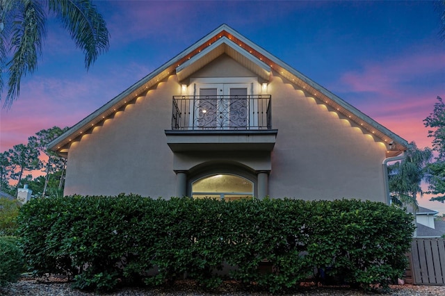 32 Allenwood Look, Ormond Beach, FL 32174 - view of side of property featuring a balcony and stucco siding