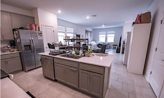 4152 Pino St, Apopka, FL 32712 - kitchen featuring gray cabinetry, stainless steel appliances, a kitchen island, recessed lighting, and light countertops
