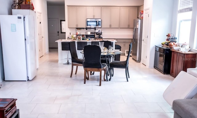 4152 Pino St, Apopka, FL 32712 - kitchen with appliances with stainless steel finishes, light countertops, and gray cabinets