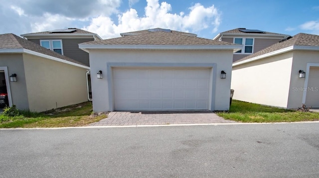 4152 Pino St, Apopka, FL 32712 - view of front facade featuring stucco siding, a garage, and a shingled roof