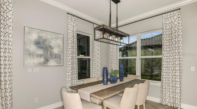 858 Arbor Green Trl, Saint Cloud, FL 34771 - dining area featuring crown molding and baseboards