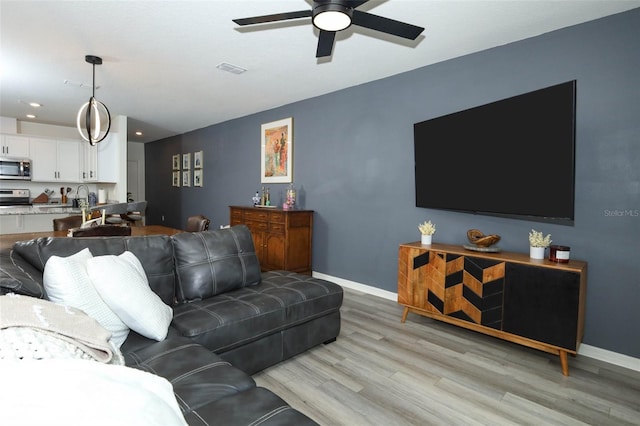 2326 Carrabelle Way, Sanford, FL 32771 - living room with a ceiling fan, light wood-style flooring, and recessed lighting