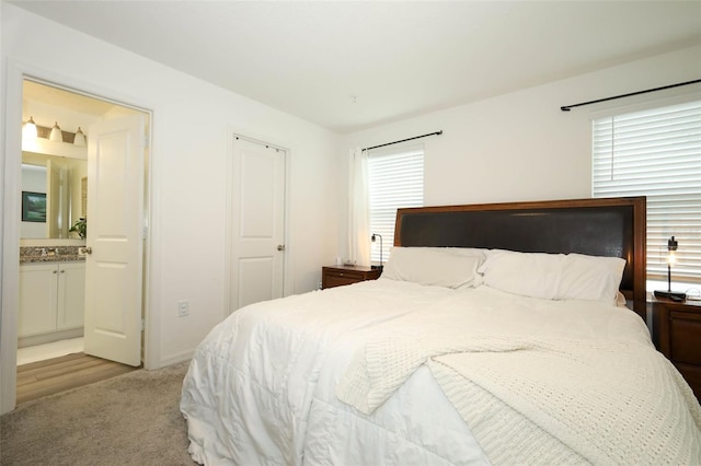2326 Carrabelle Way, Sanford, FL 32771 - bedroom with light carpet and ensuite bath