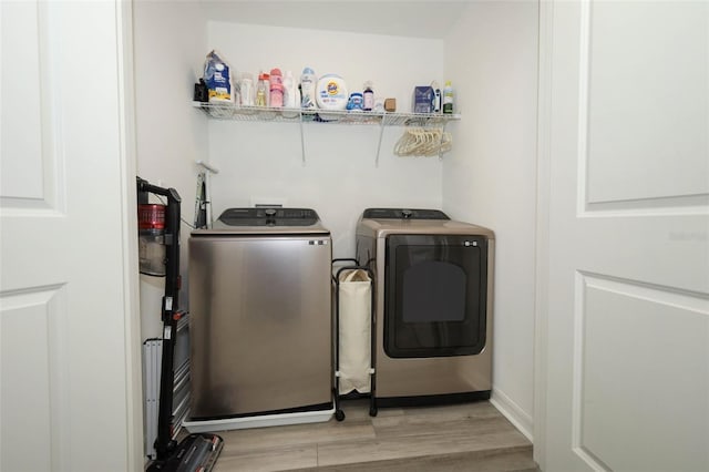 2326 Carrabelle Way, Sanford, FL 32771 - washroom with washer and clothes dryer and light wood-style floors
