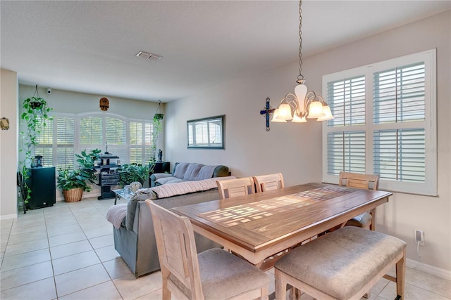 480 Kestrel Dr, Groveland, FL 34736 - dining space with a chandelier and light tile patterned floors