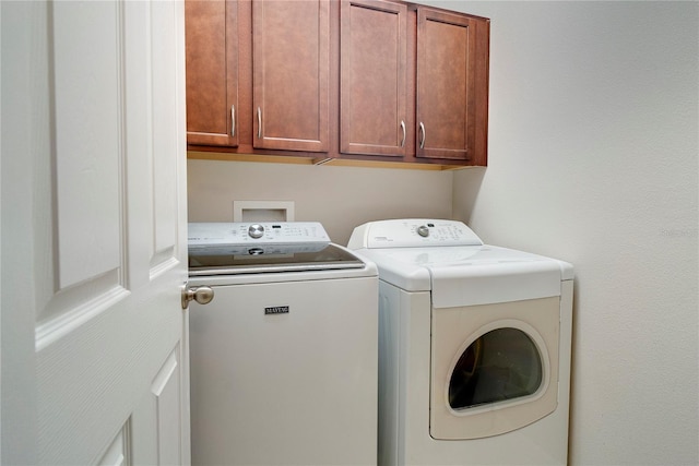 480 Kestrel Dr, Groveland, FL 34736 - laundry room featuring washer and clothes dryer and cabinet space