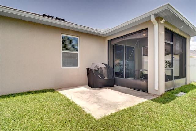 480 Kestrel Dr, Groveland, FL 34736 - view of patio with a sunroom and area for grilling