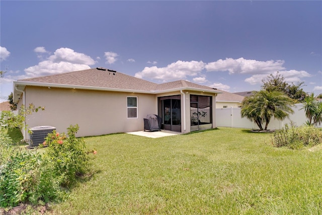 480 Kestrel Dr, Groveland, FL 34736 - rear view of property with a fenced backyard, stucco siding, a sunroom, a patio area, and roof with shingles