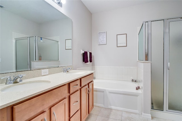 480 Kestrel Dr, Groveland, FL 34736 - bathroom with a shower stall, double vanity, a garden tub, and tile patterned flooring