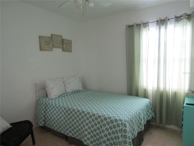5010 Shoshone St, Orlando, FL 32819 - bedroom with light tile patterned flooring, multiple windows, and a ceiling fan