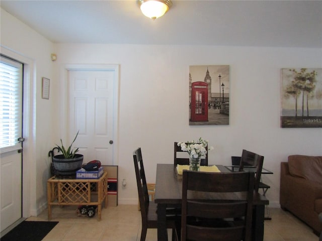5010 Shoshone St, Orlando, FL 32819 - dining space featuring light tile patterned floors and healthy amount of natural light
