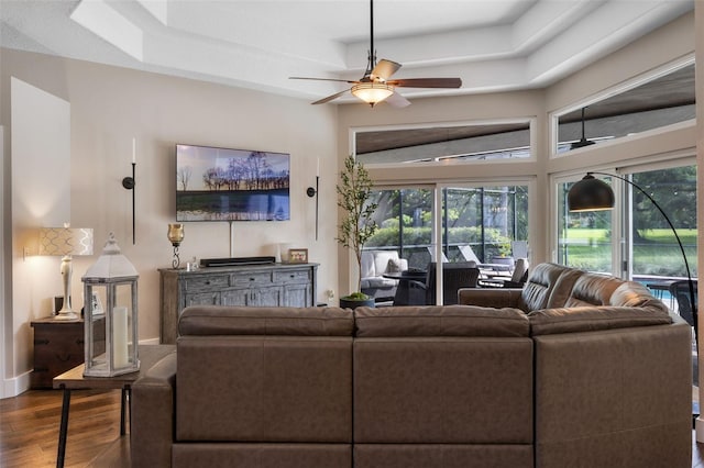5141 Autumn Ridge Ln, Windermere, FL 34786 - living room featuring healthy amount of natural light, wood finished floors, a ceiling fan, and a raised ceiling