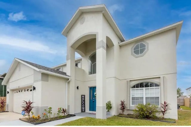 365 Aylesbury Ct, Kissimmee, FL 34758 - view of front of property featuring stucco siding, an attached garage, a front yard, and driveway