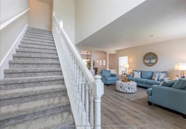 365 Aylesbury Ct, Kissimmee, FL 34758 - stairway featuring wood finished floors and arched walkways