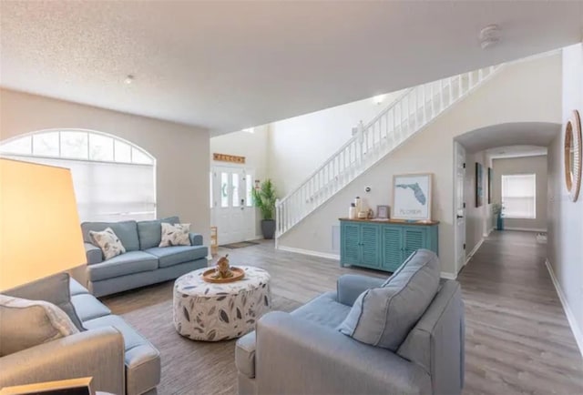 365 Aylesbury Ct, Kissimmee, FL 34758 - living area featuring wood finished floors and stairway