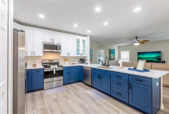 365 Aylesbury Ct, Kissimmee, FL 34758 - kitchen featuring appliances with stainless steel finishes, a peninsula, ceiling fan, light countertops, and recessed lighting