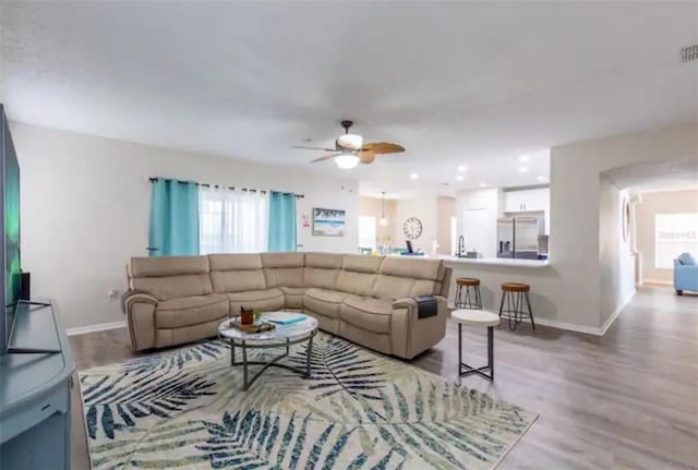 365 Aylesbury Ct, Kissimmee, FL 34758 - living room featuring ceiling fan and wood finished floors
