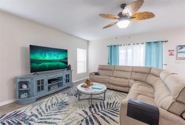 365 Aylesbury Ct, Kissimmee, FL 34758 - living room featuring baseboards and a ceiling fan