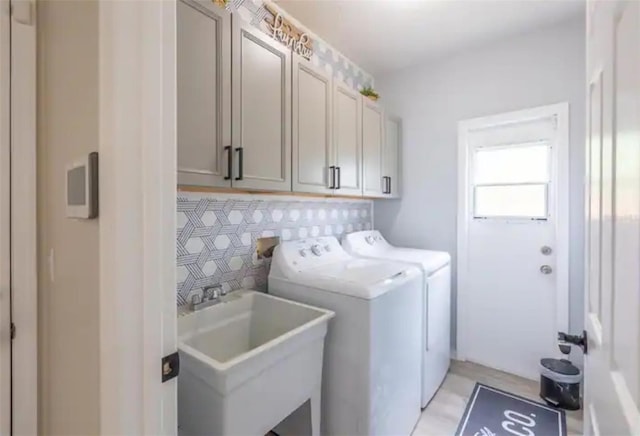 365 Aylesbury Ct, Kissimmee, FL 34758 - laundry area featuring washer and clothes dryer and cabinet space