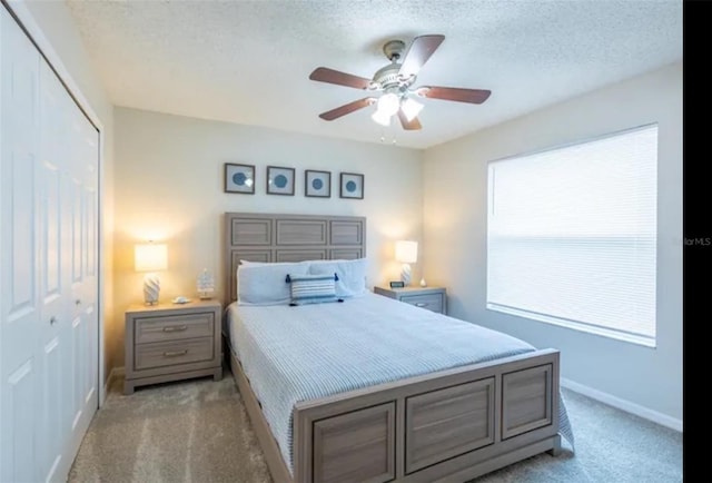 365 Aylesbury Ct, Kissimmee, FL 34758 - carpeted bedroom featuring a closet, a textured ceiling, and ceiling fan