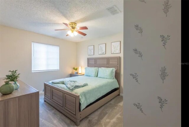 365 Aylesbury Ct, Kissimmee, FL 34758 - bedroom featuring light colored carpet, a textured ceiling, and a ceiling fan