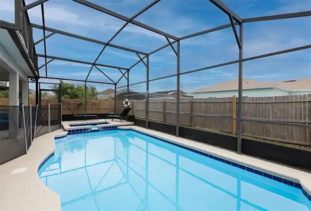 365 Aylesbury Ct, Kissimmee, FL 34758 - view of swimming pool featuring a pool with connected hot tub, a lanai, and a patio