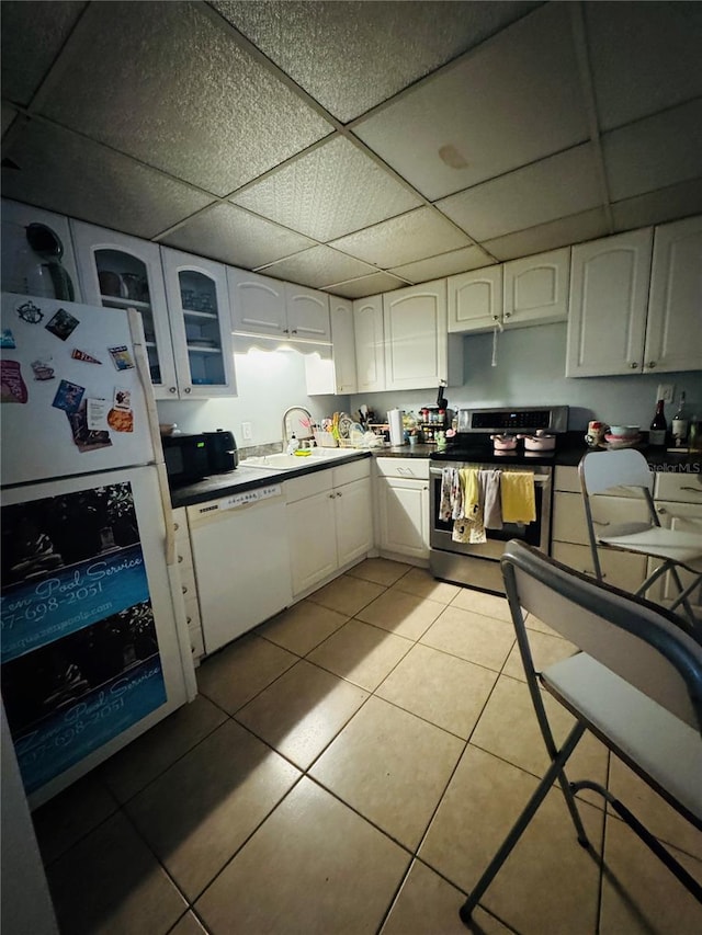 860 Park Lake Cir Unit 53, Maitland, FL 32751 - kitchen with stainless steel range with electric cooktop, dishwasher, a paneled ceiling, white cabinetry, and light tile patterned floors