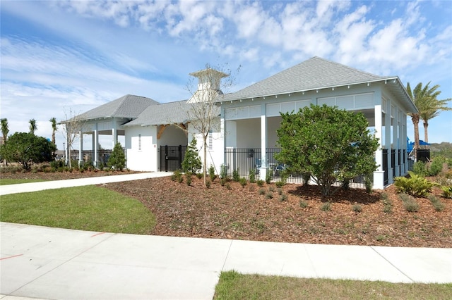 3336 Thicket St, Tavares, FL 32778 - view of front facade featuring roof with shingles