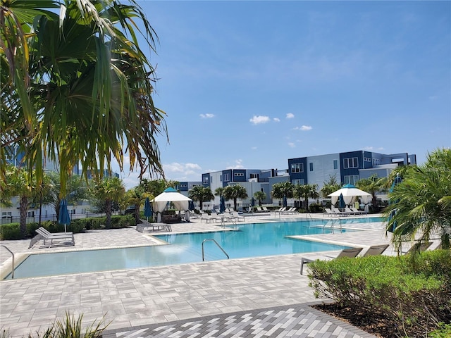 7740 Sandy Ridge Dr Unit 102, Reunion, FL 34747 - community pool featuring a patio and a gazebo