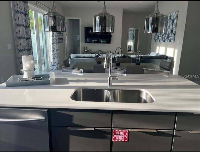 7740 Sandy Ridge Dr Unit 102, Reunion, FL 34747 - kitchen with open floor plan, light countertops, and stainless steel dishwasher