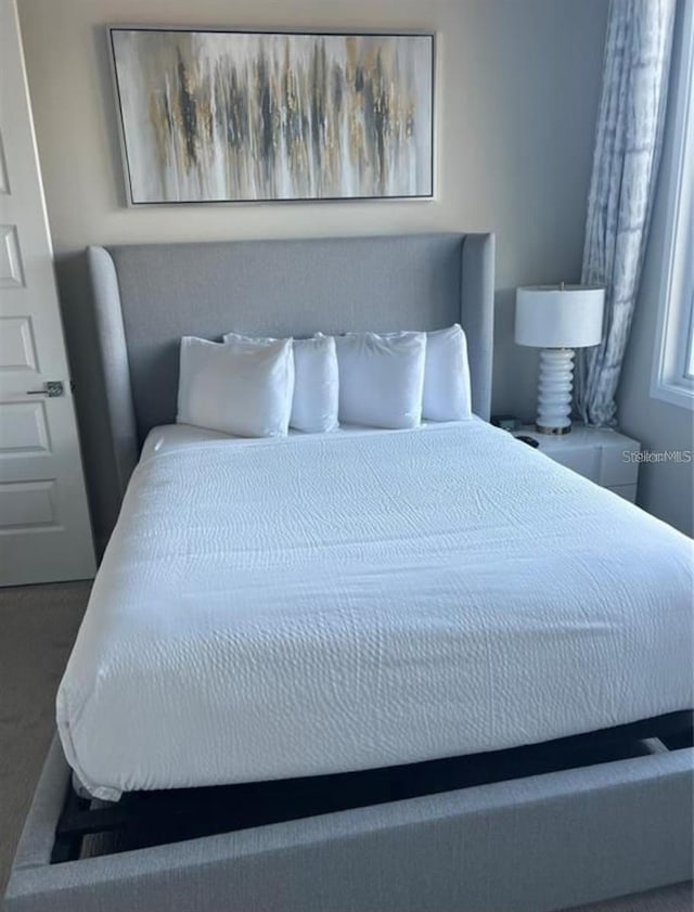 7740 Sandy Ridge Dr Unit 102, Reunion, FL 34747 - bedroom featuring carpet flooring