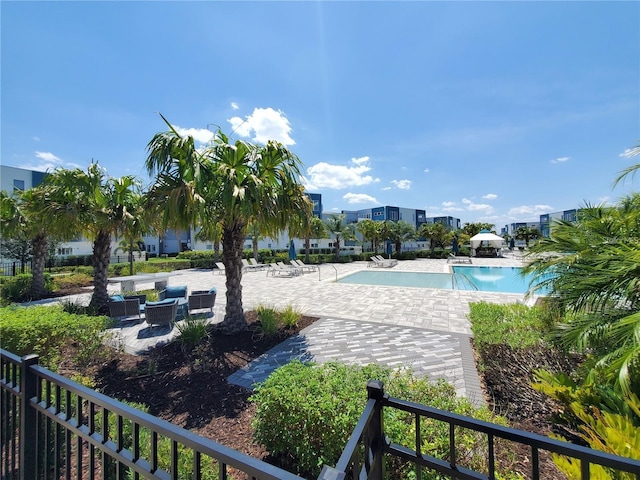 7740 Sandy Ridge Dr Unit 102, Reunion, FL 34747 - community pool with a patio area