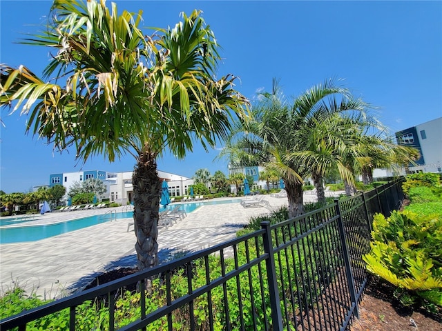 7740 Sandy Ridge Dr Unit 102, Reunion, FL 34747 - community pool featuring a patio area