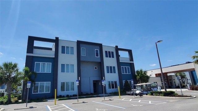 7740 Sandy Ridge Dr Unit 102, Reunion, FL 34747 - view of property featuring uncovered parking