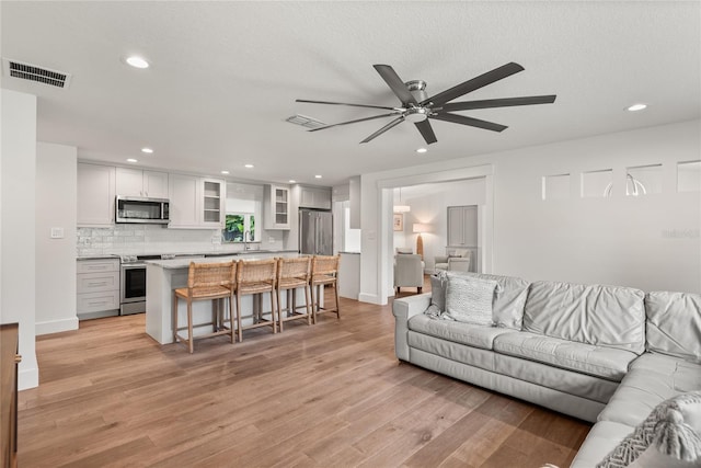 91 Minnehaha Cir, Maitland, FL 32751 - living area featuring a ceiling fan, recessed lighting, and light wood-type flooring