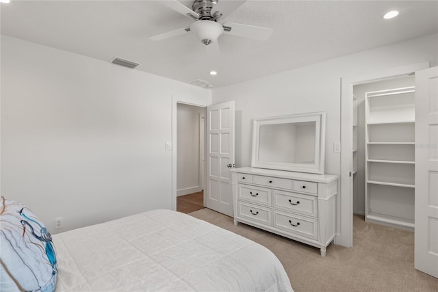 91 Minnehaha Cir, Maitland, FL 32751 - bedroom with a spacious closet, recessed lighting, light carpet, and ceiling fan