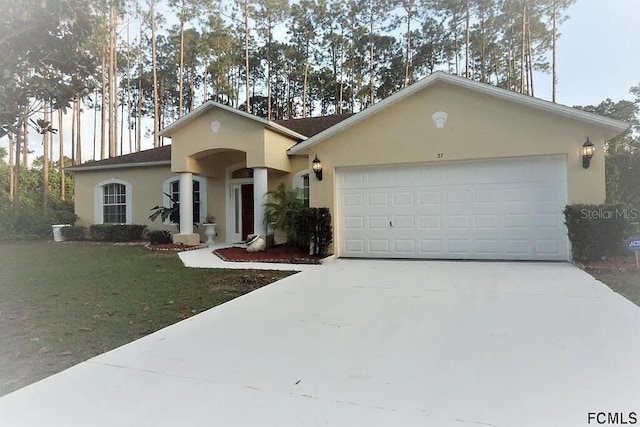 37 Ethan Allen Dr, Palm Coast, FL 32164 - ranch-style home featuring driveway, stucco siding, a garage, and a front lawn