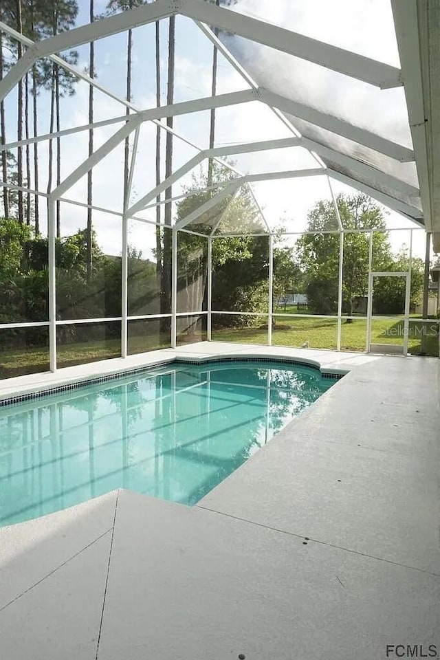 37 Ethan Allen Dr, Palm Coast, FL 32164 - swimming pool with a patio area and a lanai