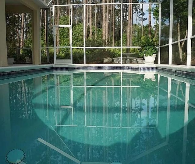 37 Ethan Allen Dr, Palm Coast, FL 32164 - outdoor pool with glass enclosure