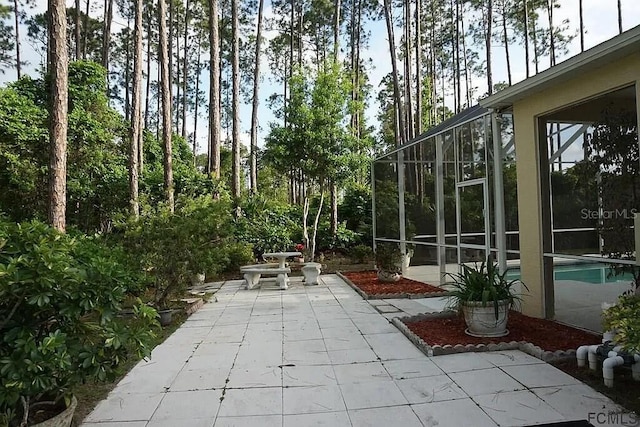 37 Ethan Allen Dr, Palm Coast, FL 32164 - view of patio with an outdoor pool and glass enclosure