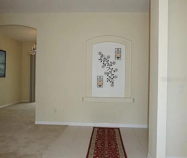 37 Ethan Allen Dr, Palm Coast, FL 32164 - unfurnished room with arched walkways and baseboards