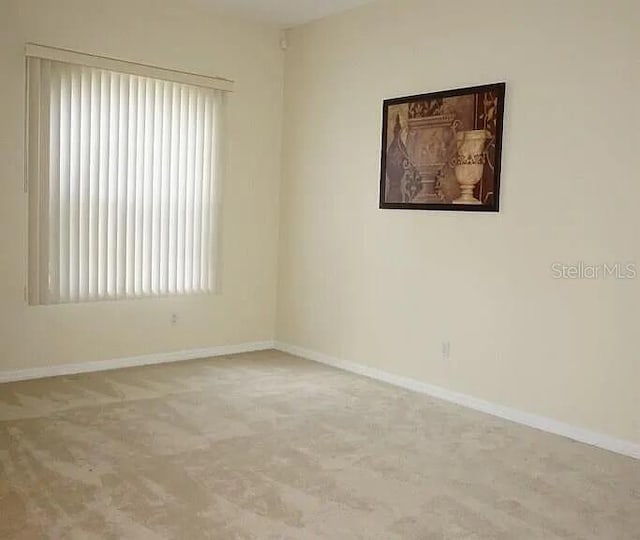 37 Ethan Allen Dr, Palm Coast, FL 32164 - spare room with baseboards