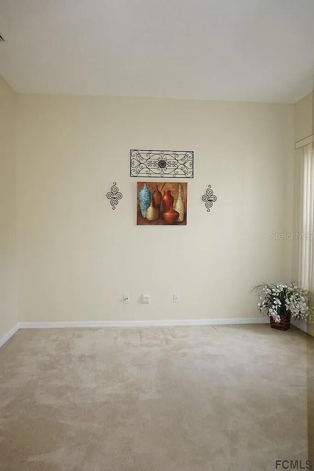 37 Ethan Allen Dr, Palm Coast, FL 32164 - carpeted empty room featuring baseboards
